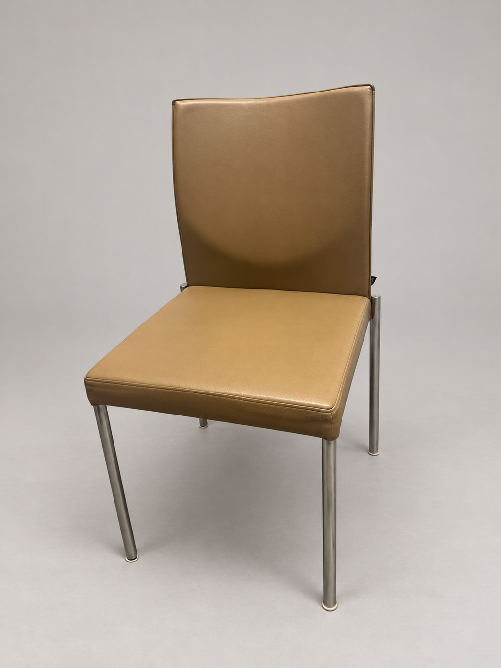 KFF chair angle view; edited studio background; originals retained