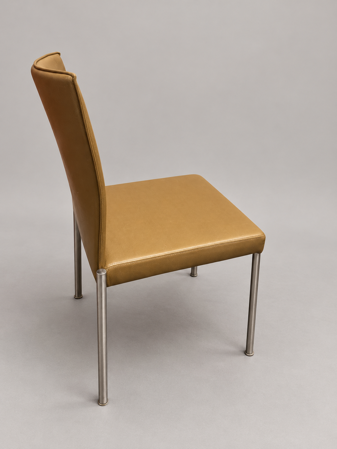 KFF chair angle view; edited studio background; originals retained