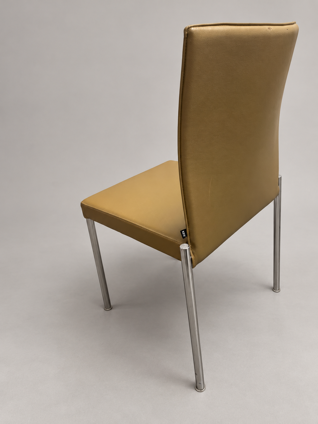 KFF chair rear view; edited studio background; originals retained
