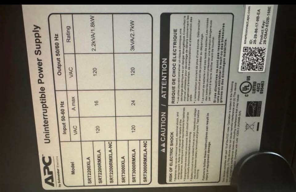 Original close view of the APC SRT2200XLA power rating and safety label