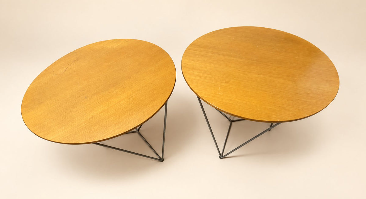 Actual Davis round table pair on a clean staged cream background; visible tabletop wear retained