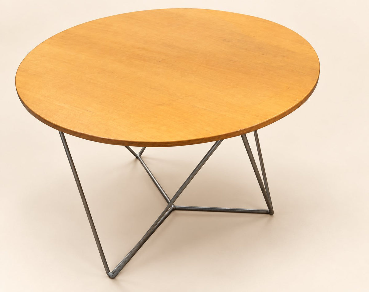 Actual Davis round table A on a clean staged cream background; visible surface condition retained