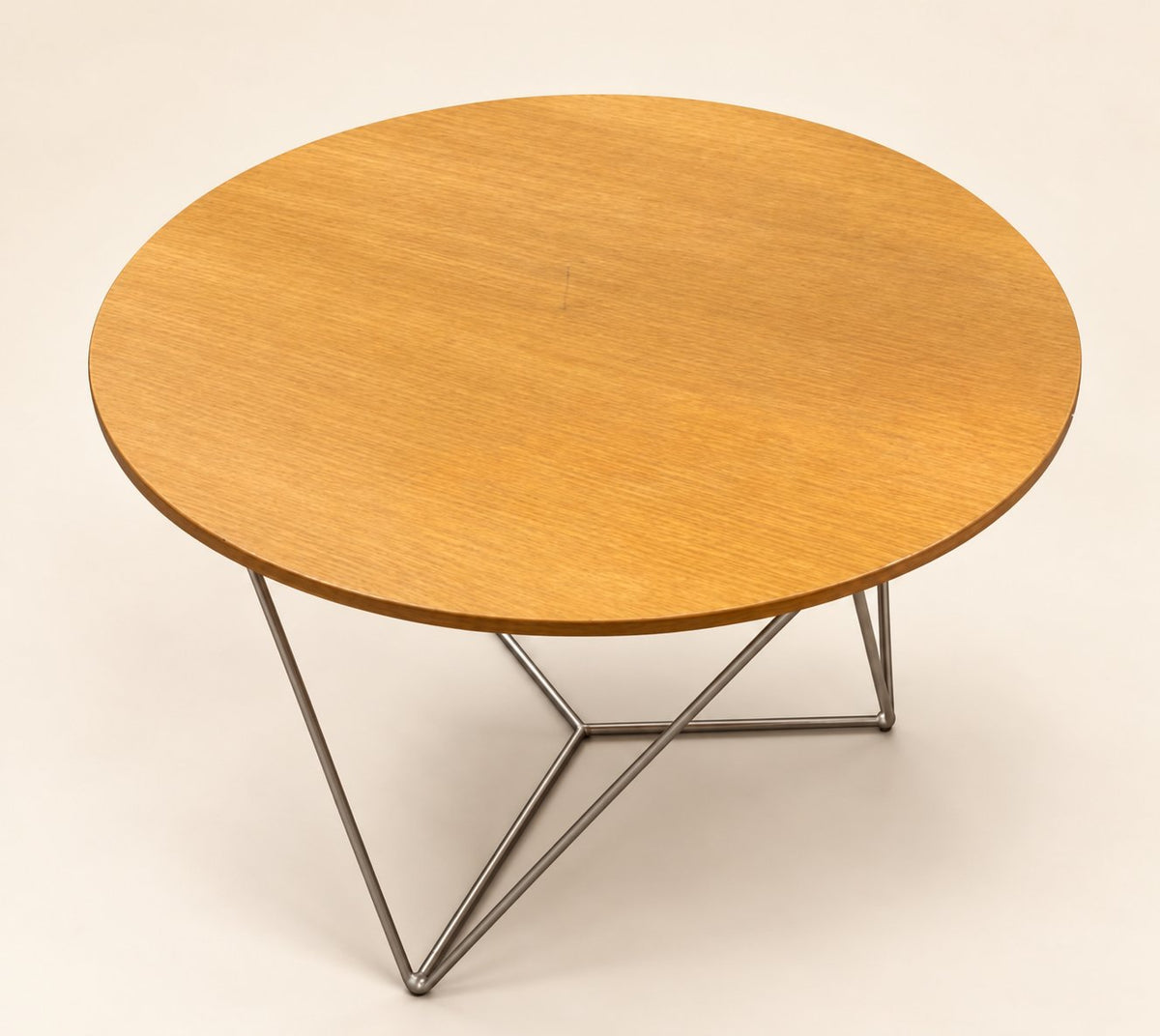 Actual Davis round table B on a clean staged cream background; visible surface condition retained
