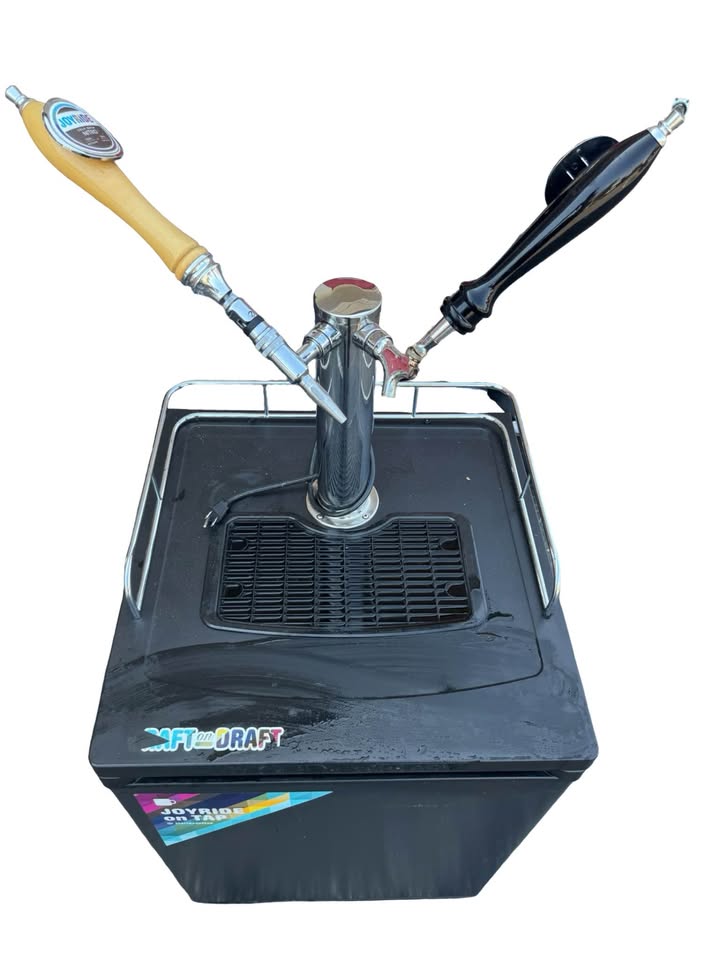 Top view of the actual dual-tap tower, handles, drip tray, rails and surface wear