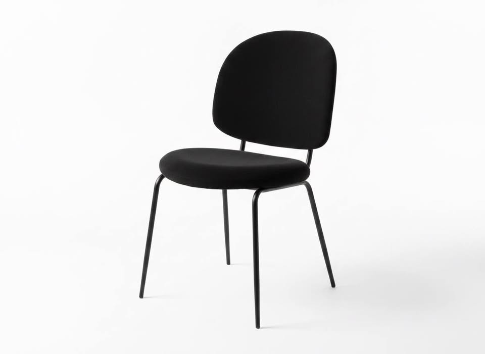 Source photograph of one black upholstered Stellar Works chair
