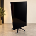 Samsung QN82Q6FNAFXZA 82-inch QLED TV with the photographed rolling stand; staged clean-background hero