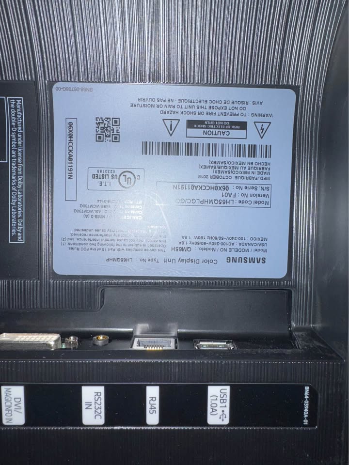 Samsung QM65H exact manufacturer label and connection-panel close-up