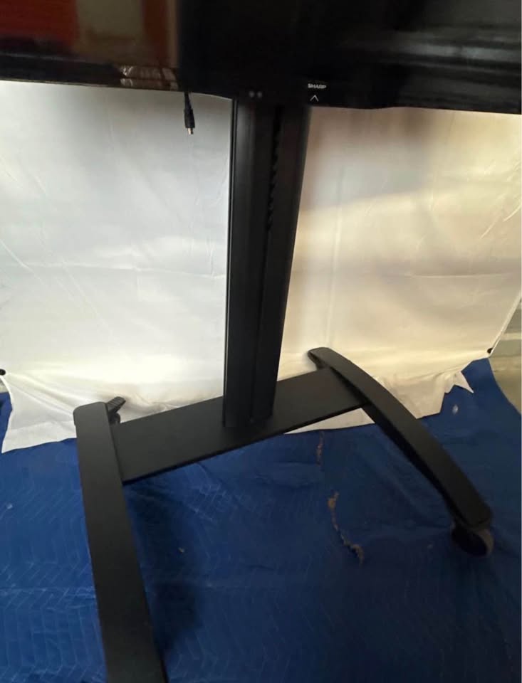 Black rolling display cart — base, column and casters