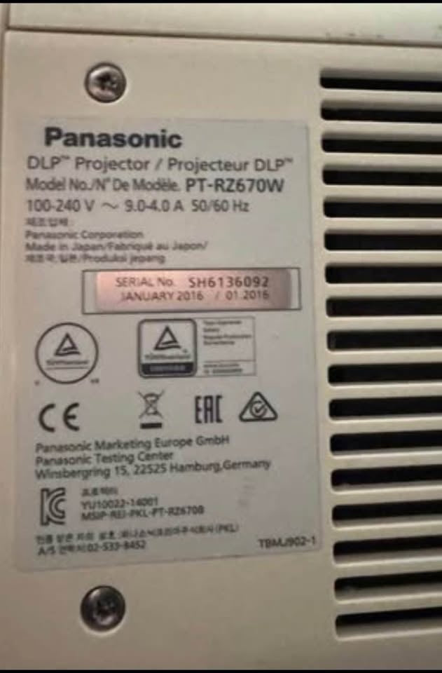 Original Panasonic PT-RZ670W manufacturer and serial label; rotated for readability