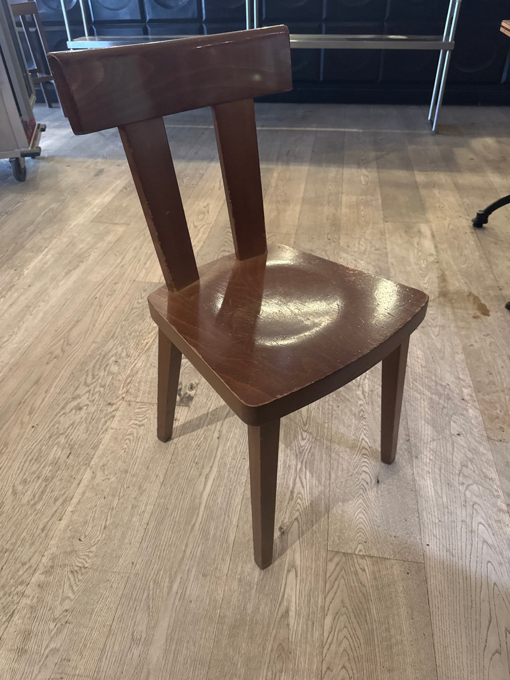 Original chair front photograph showing seat and edge finish wear.