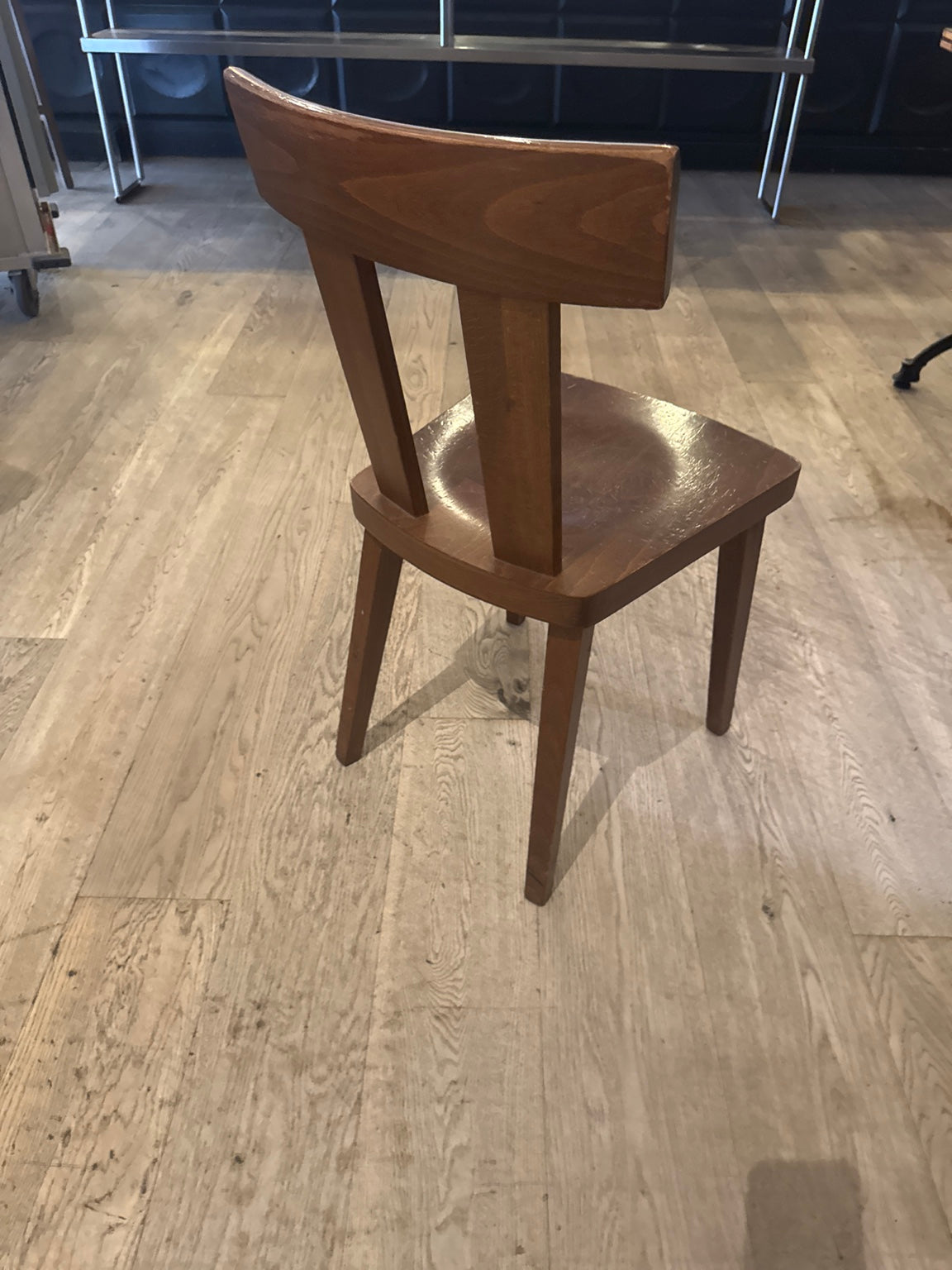 Original chair rear photograph showing back and wood frame.