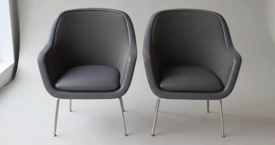 Historical source overview of two gray upholstered guest chairs; maker and current quantity unconfirmed