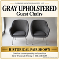 Brand-neutral presentation of historical gray guest-chair pair; background edited; current quantity unconfirmed