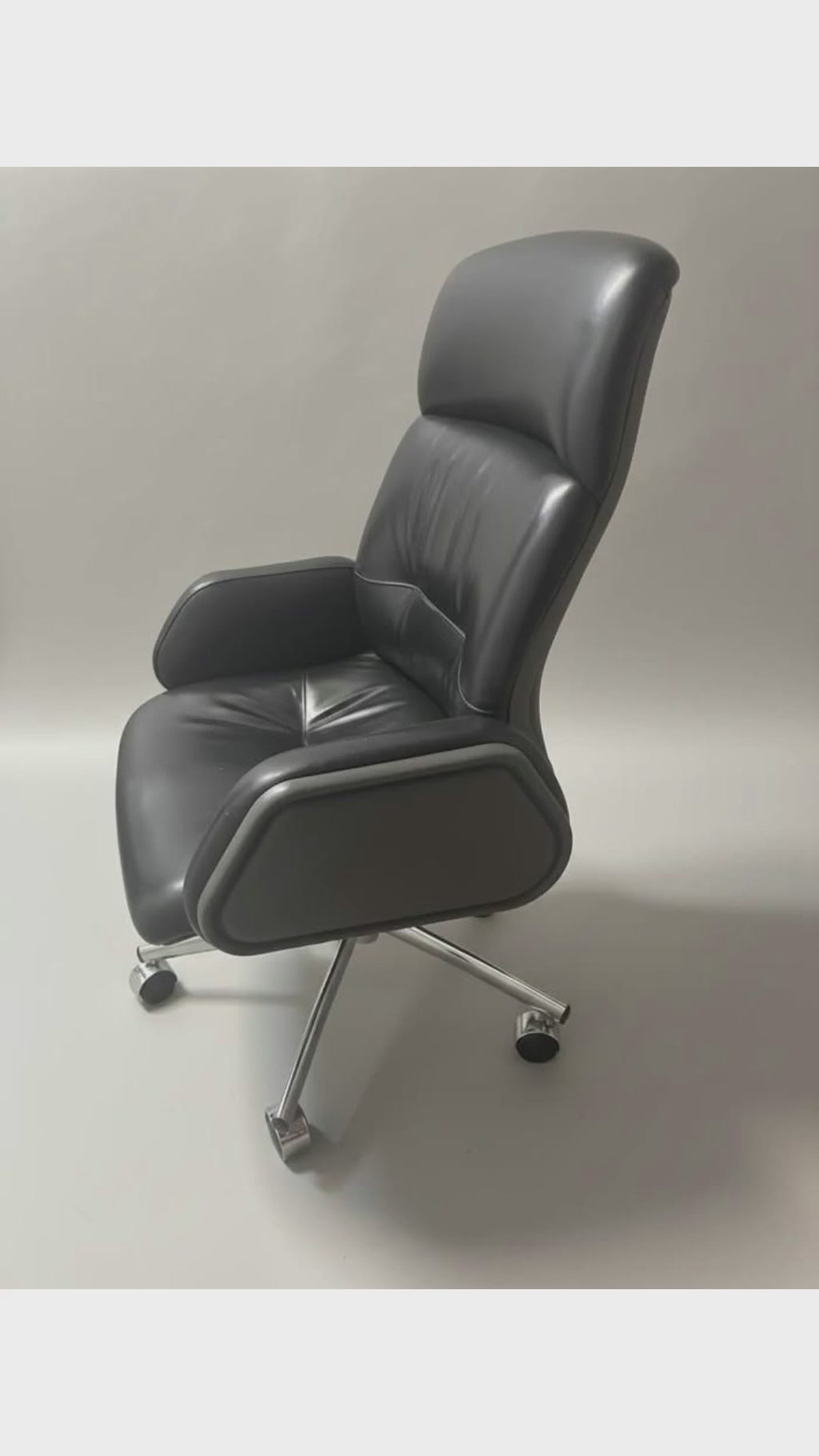 Black high-back office chair with visible cracked and peeling arm upholstery; 28-second product overview